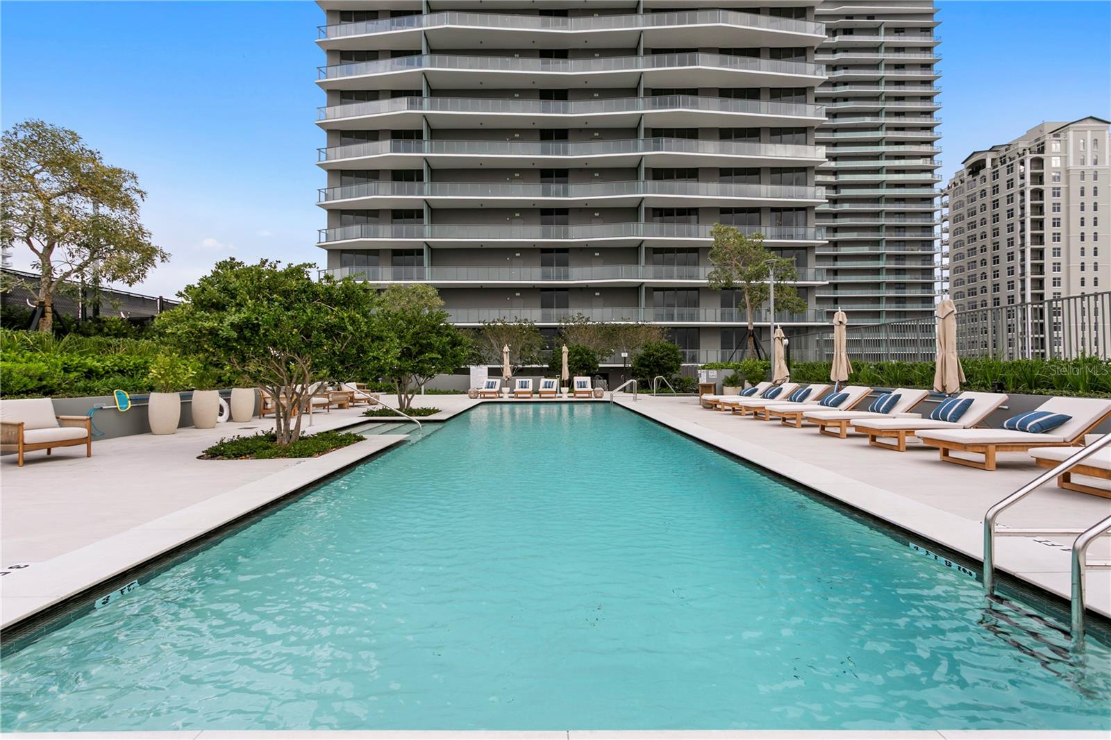 Sparkling pool features poolside dining and cabana options