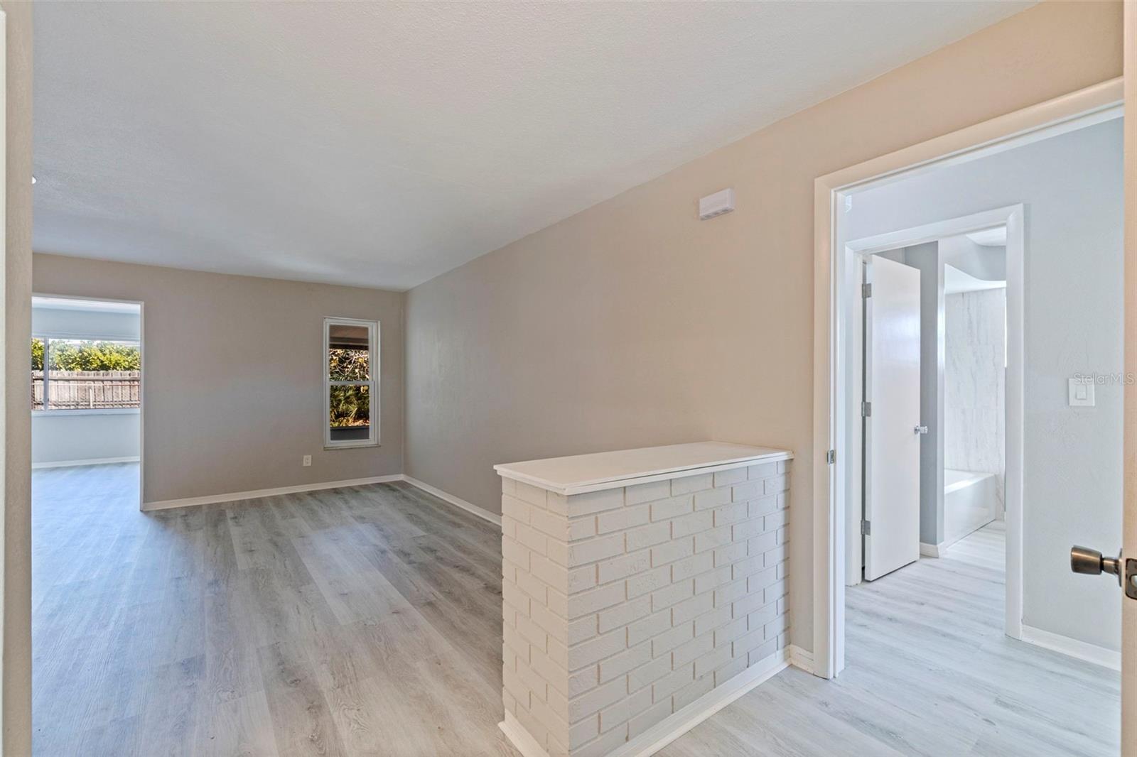 Entrance - 2 bedrooms on right, kitchen on left.