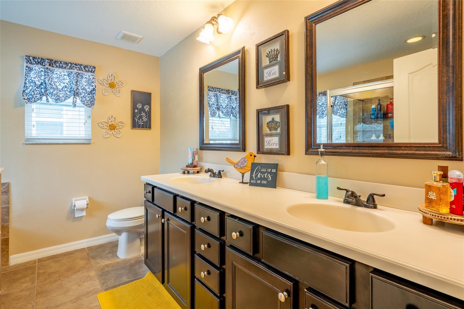 PRIMARY BATH, TILE FLOOR AND CORIAN COUNTERTOPS