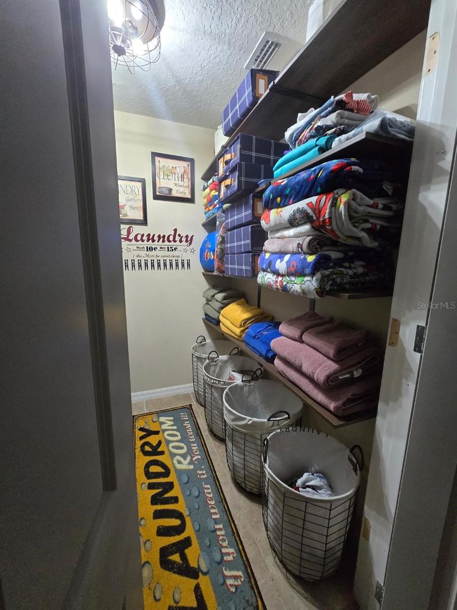 GREAT USE OF SPACE IN LAUNDRY ROOM FOR ADDITIONAL STORAGE