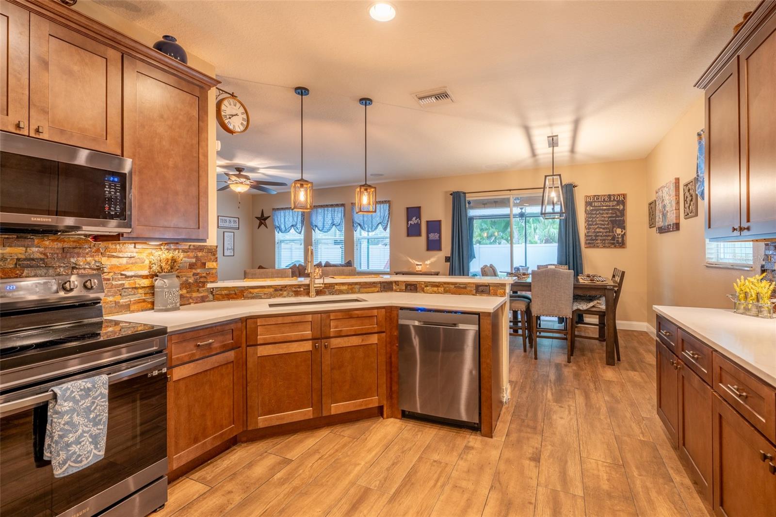 BEAUTIFUL RECENTLY REMODELED KITCHEN WITH BRICK ACCENT BACKSPLASH
