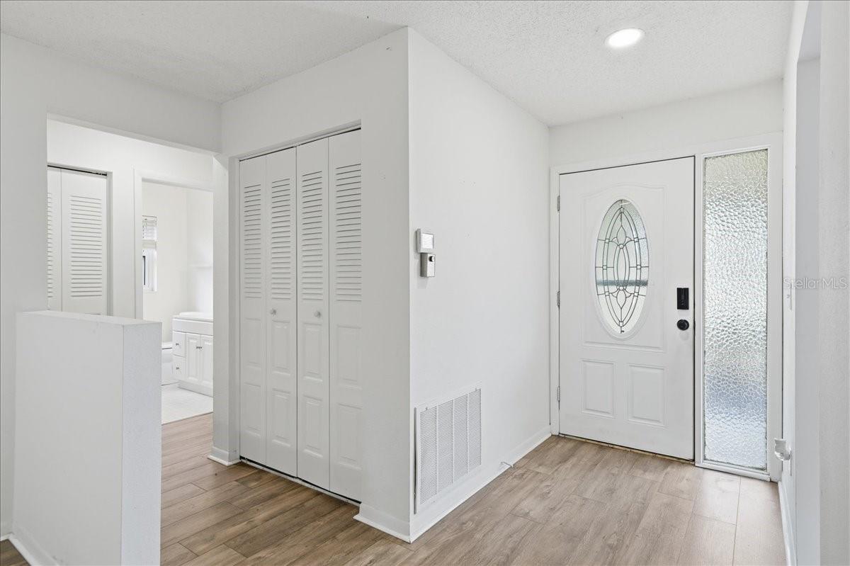 Foyer entry door with sidelight window.