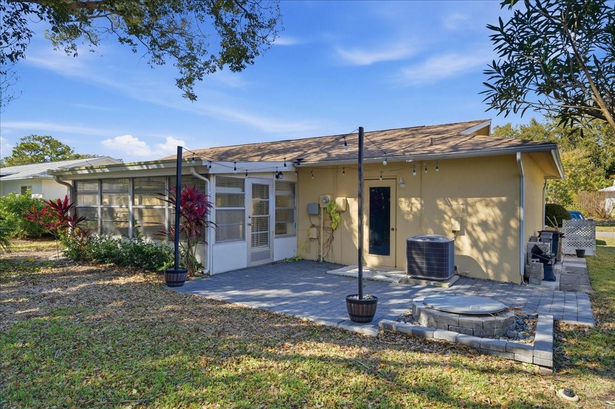Just outside the lanai in the back yard is a paver patio with firepit providing an inviting outdoor gathering area or space to enjoy the Florida weather year-round.