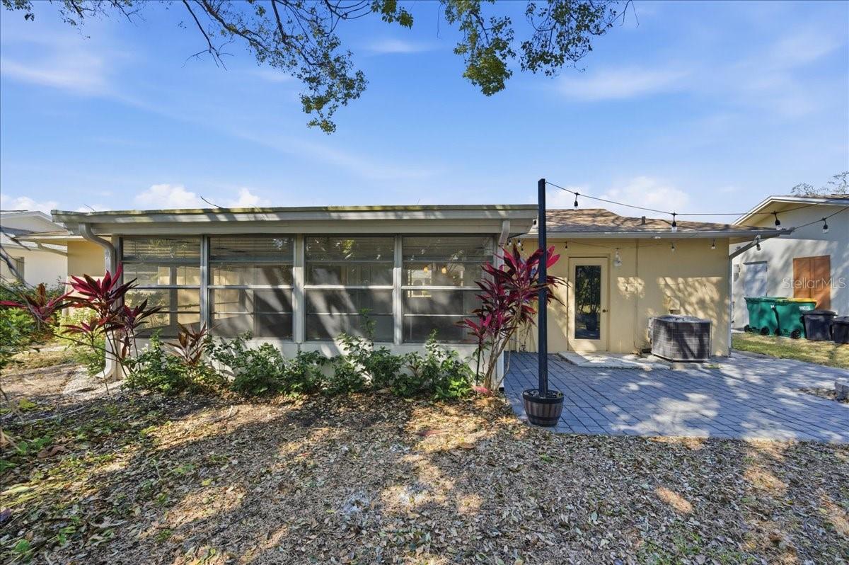 Just outside the lanai in the back yard is a paver patio with firepit providing an inviting outdoor gathering area or space to enjoy the Florida weather year-round.