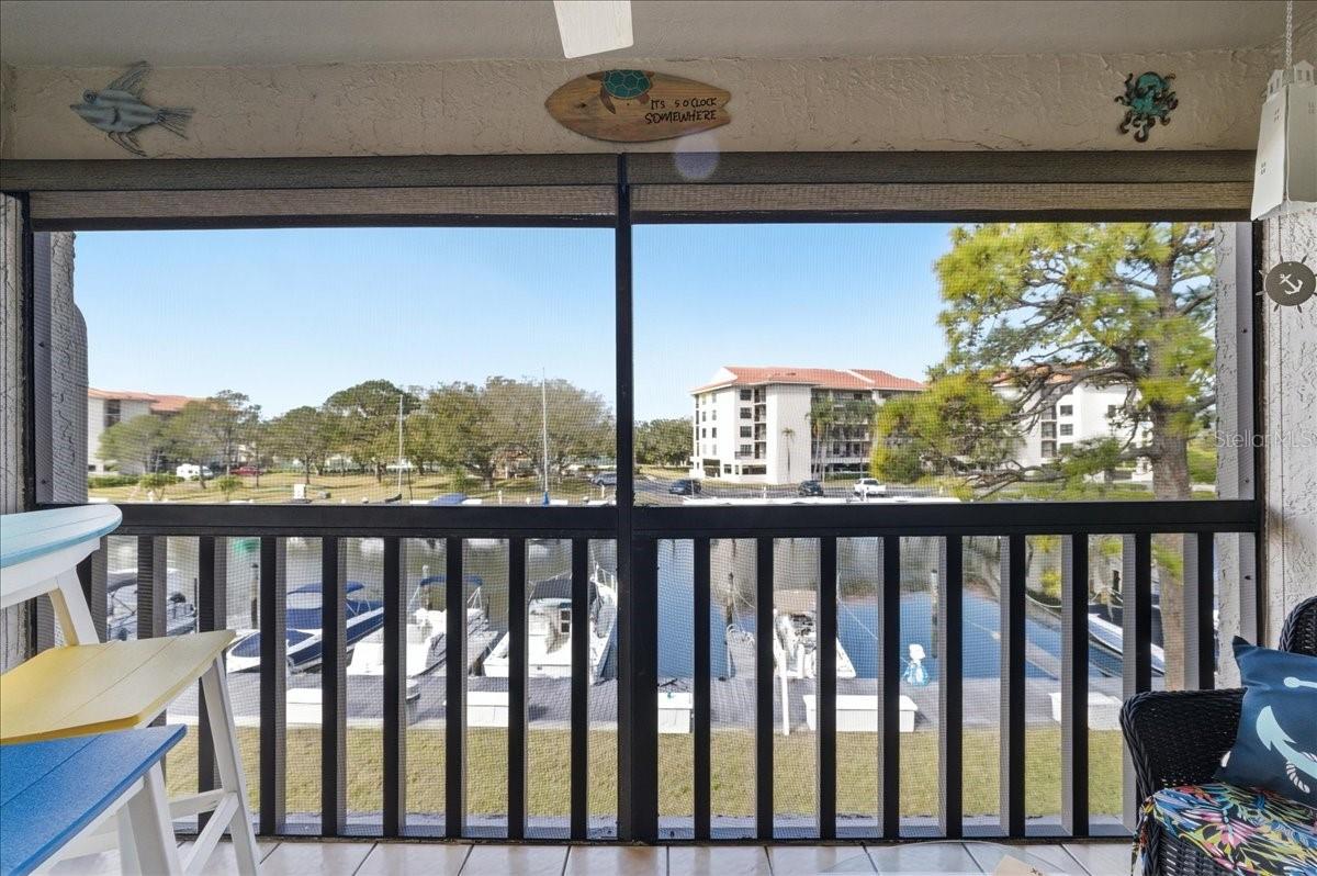 The spacious bumped-out balcony upgrades include tile floors, a decorative ceiling fan and roll down shades for comfort, and elevated second floor views of the marina and Saint Joseph Sound/Gulf of Mexico.  A truly ideal space to relax and enjoy enviable sunsets in the evenings and watch the boats come in and out and the birds and marine wildlife pass by during the day.