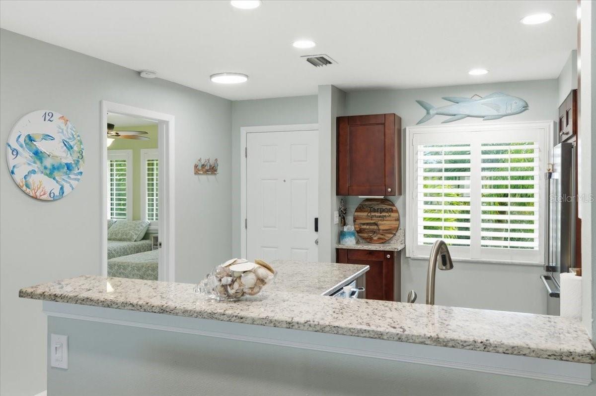 Kitchen just off the front entry and second bedroom with en-suite bath at front of home for convenient split bedroom plan privacy