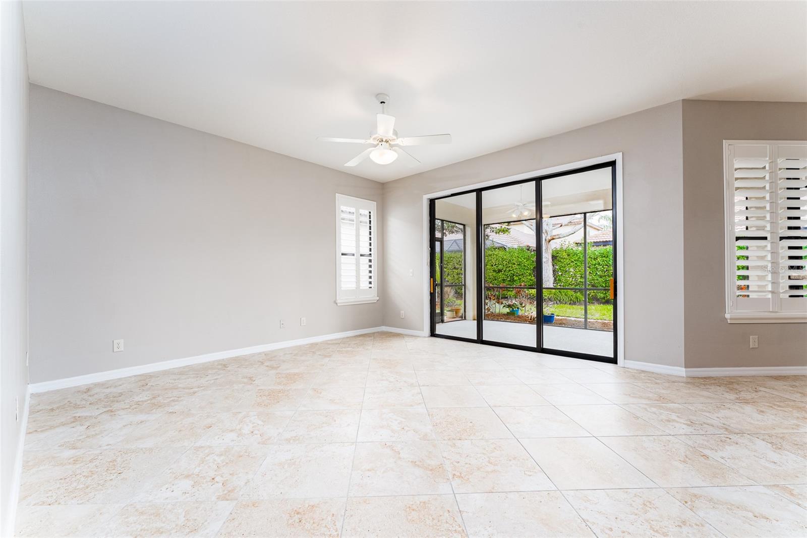 Family Room with Entrance to Back Covered Lanai Via Sliders.