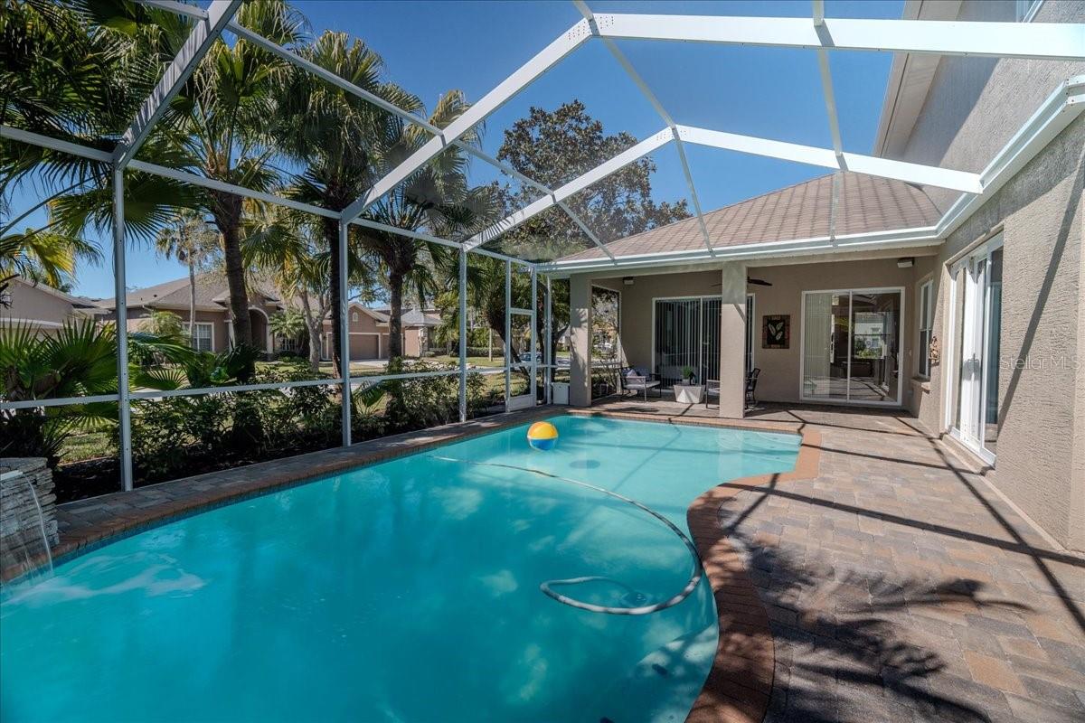 Beautifully Maintained Pool with Unique Waterfall Feature