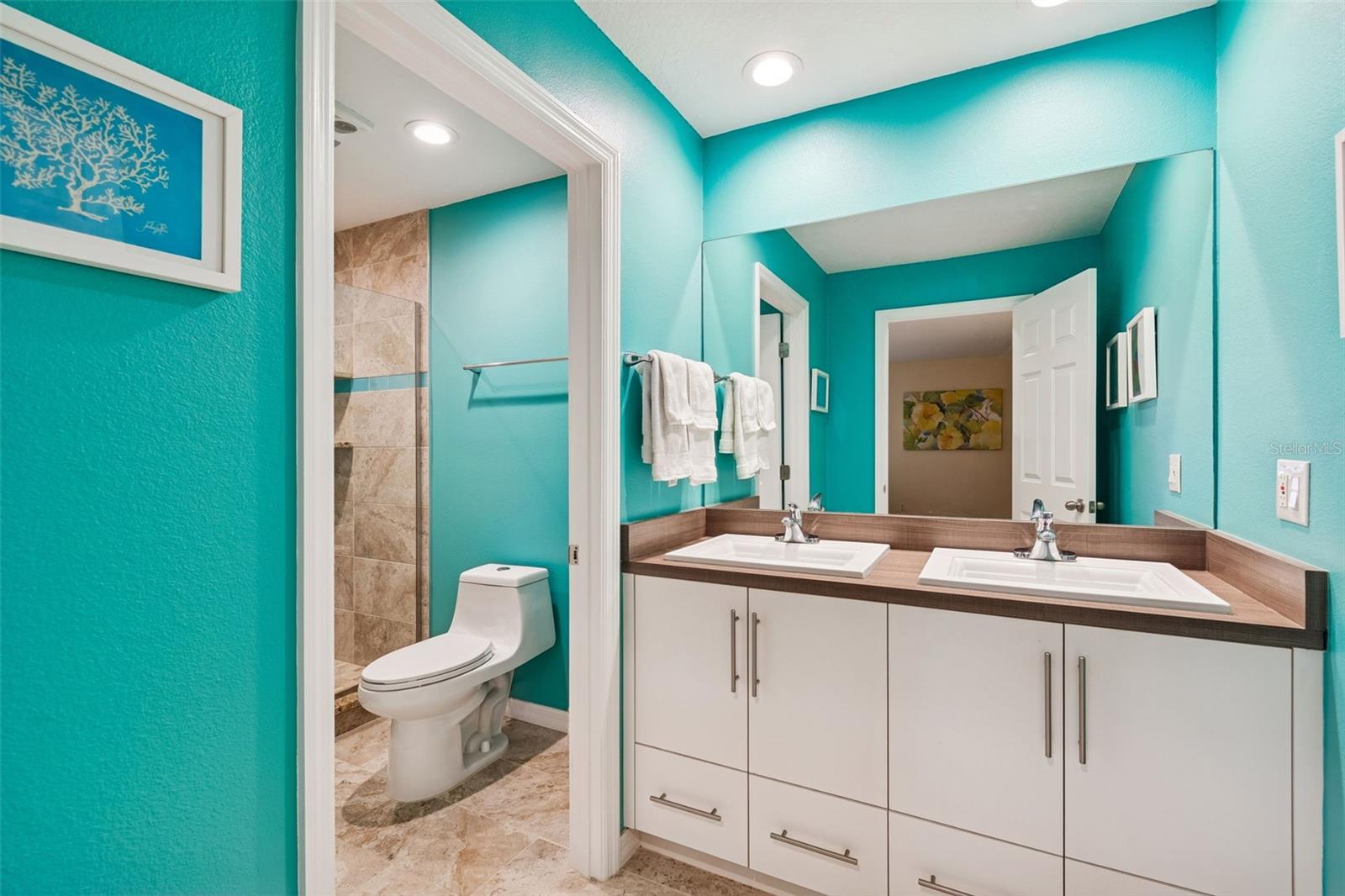 Primary bathroom with double vanity for added comfort and spaceWalk-in Shower