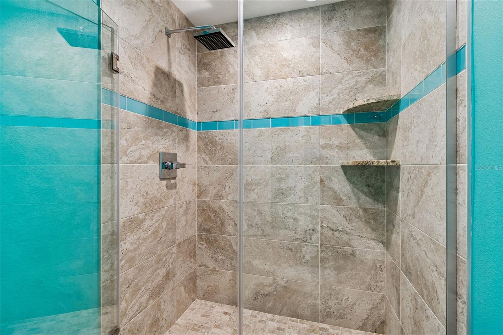 Walk-in shower with a clean, updated feel.