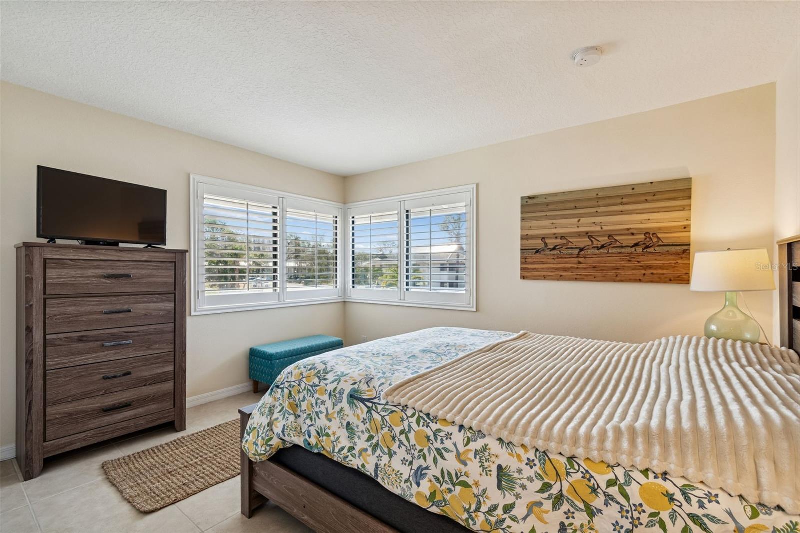 Versatile second bedroom with natural light.