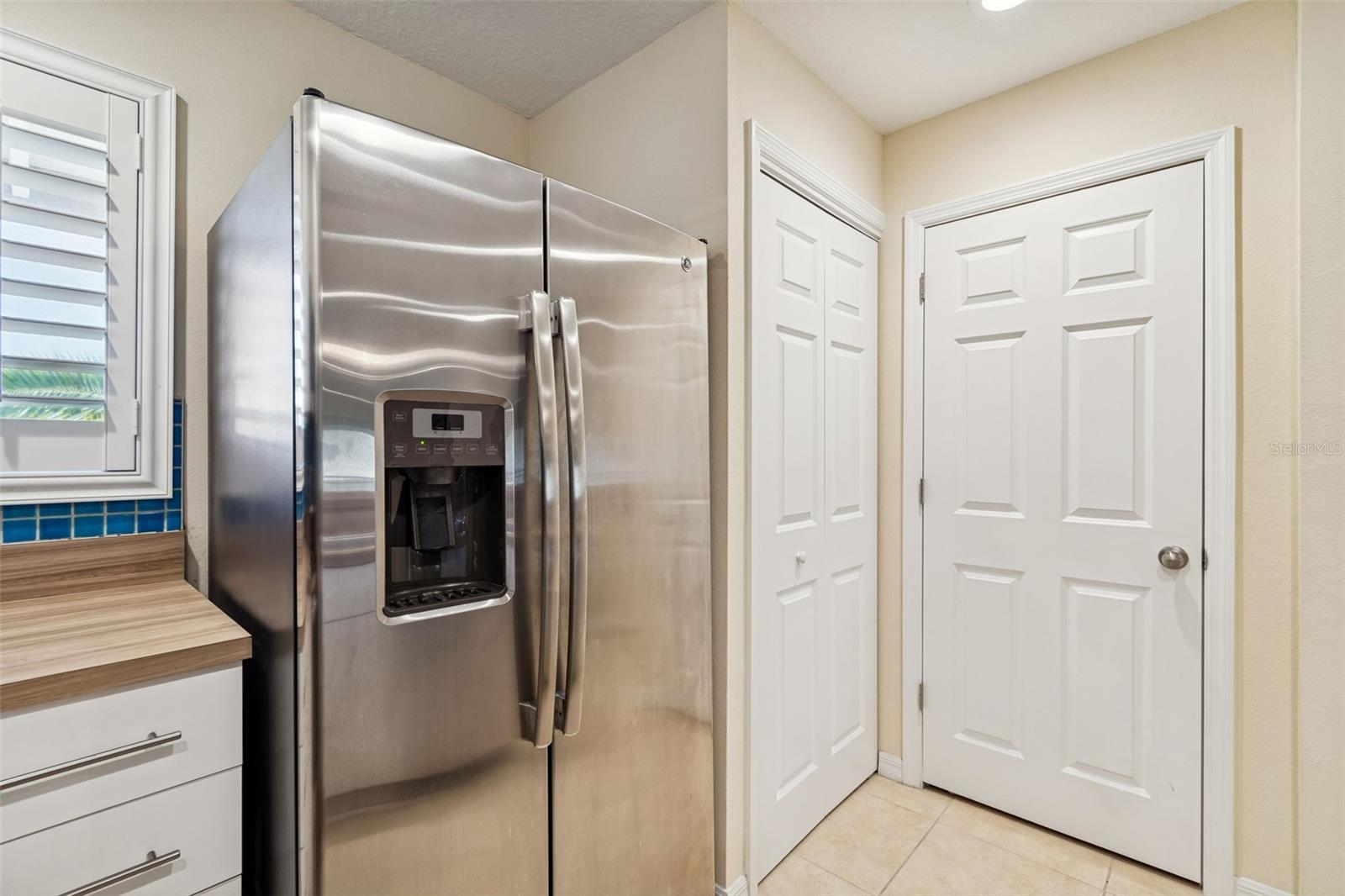 Private laundry closet and dedicated pantry for added storage