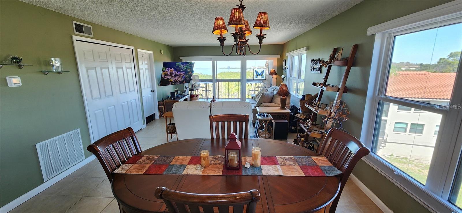 This end unit has wrap around light and views from the open dining and living area to the balcony.