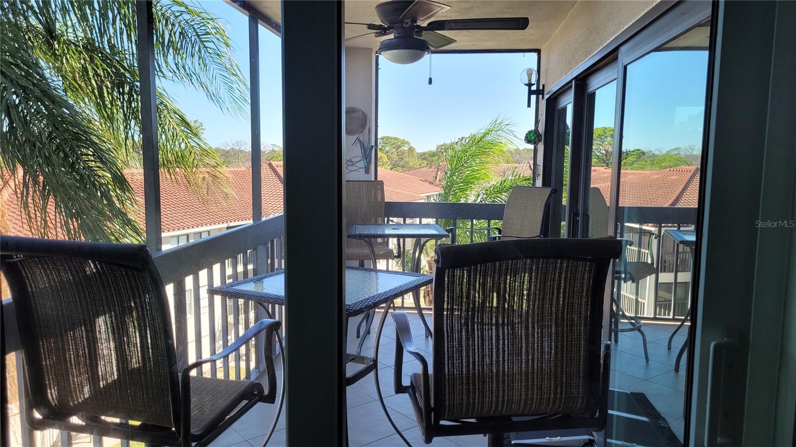 This viewing place is accessible through glass sliding doors from both the living room and primary bedroom.