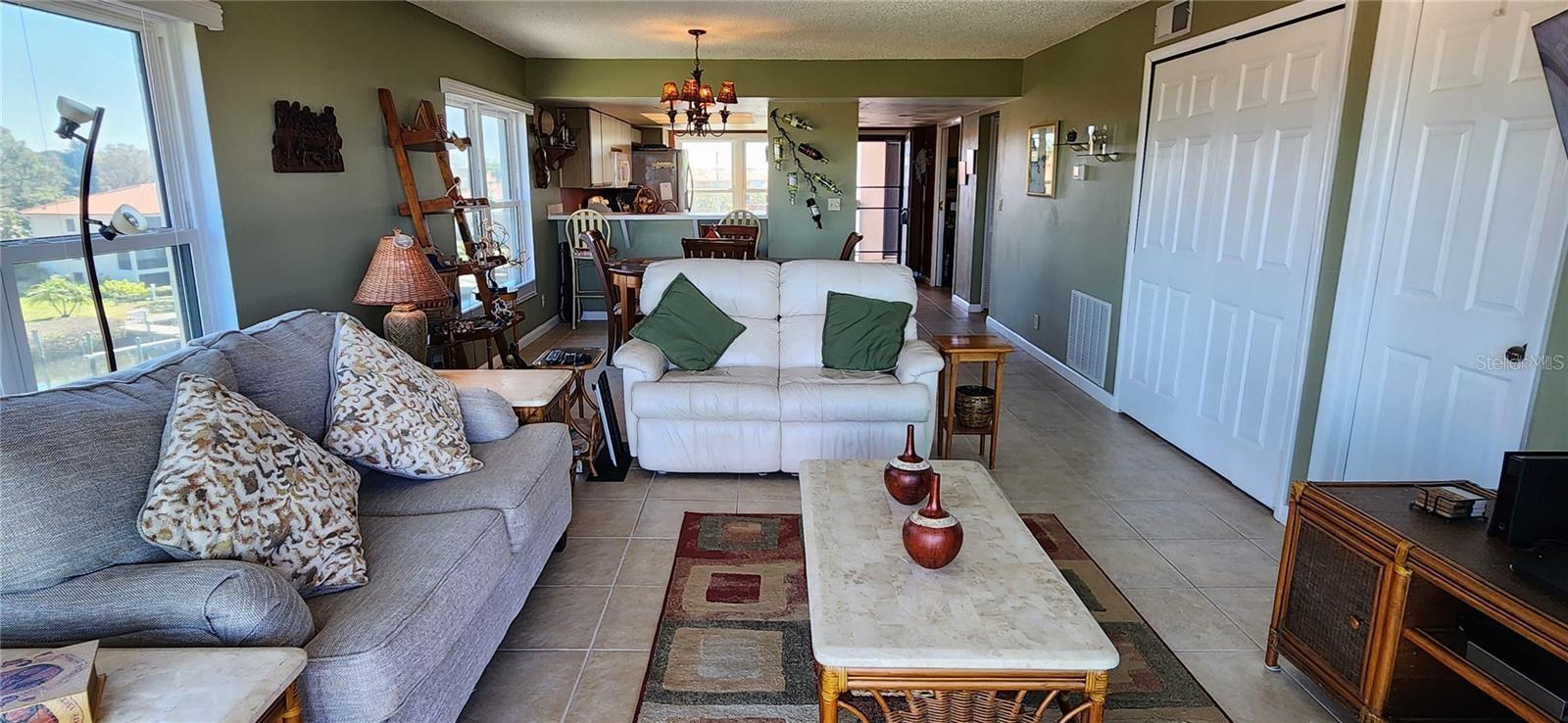 This balcony to living, dining and kitchen open areas with all it's views, is light and bright when you need it...