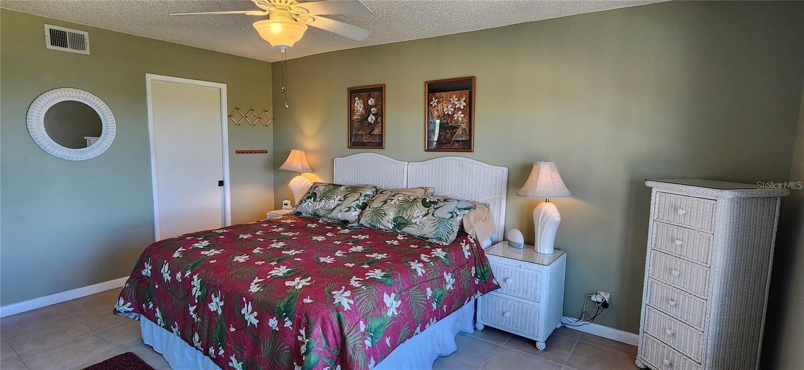 spacious enough for a king size bed, night stands, chest of drawers and dresser.