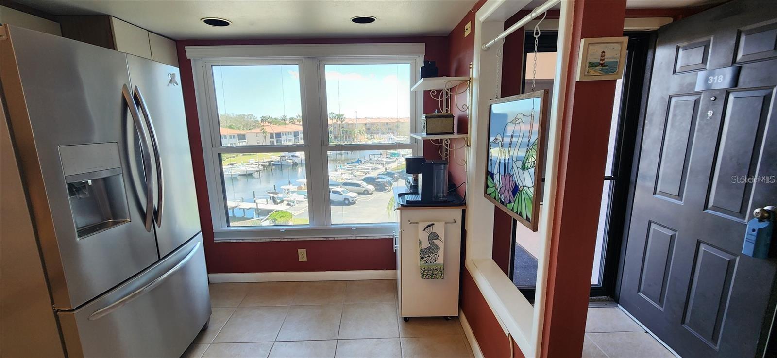 As you step through your front door, the kitchen's view of the marina allows you to check on your boat every morning or check activity going on in The Cove as you make your first cup of coffee...