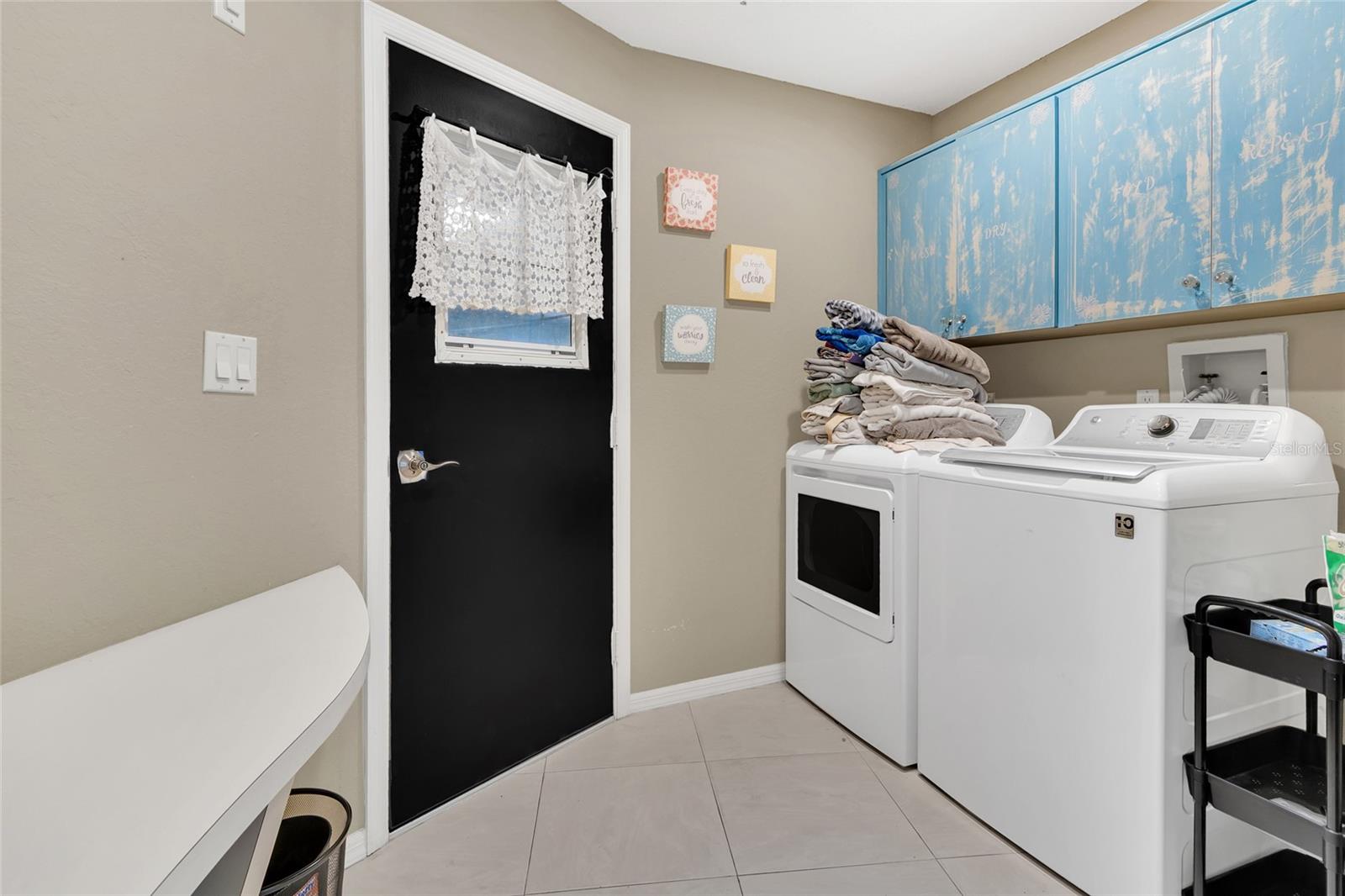 inside laundry with door to garage