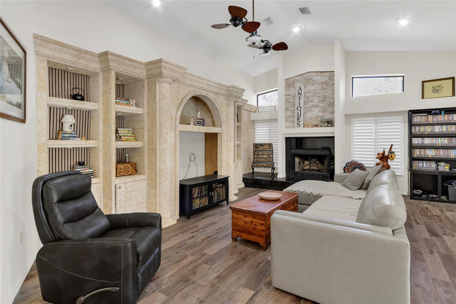 family room with fireplace and built in shelves
