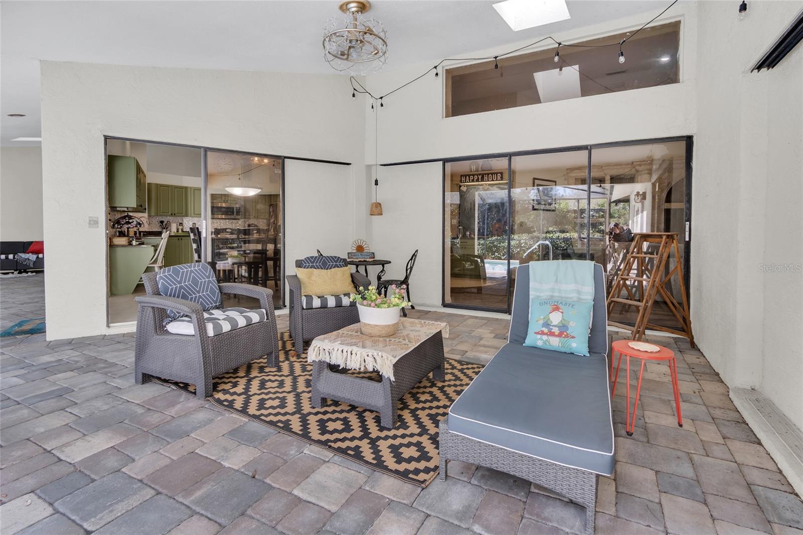 Pool deck with slider to kitchen and family room
