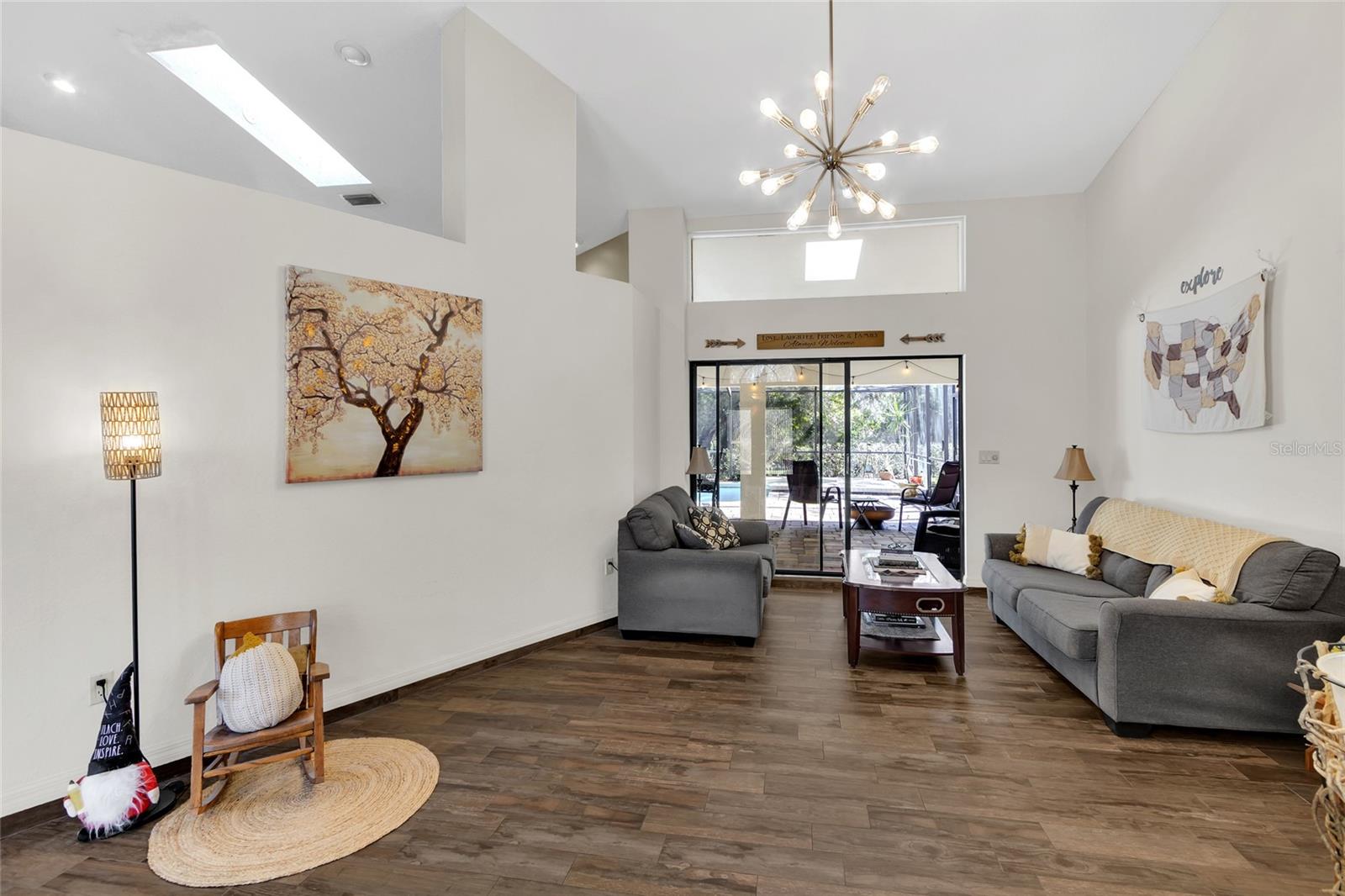 Living room with slider to pool deck