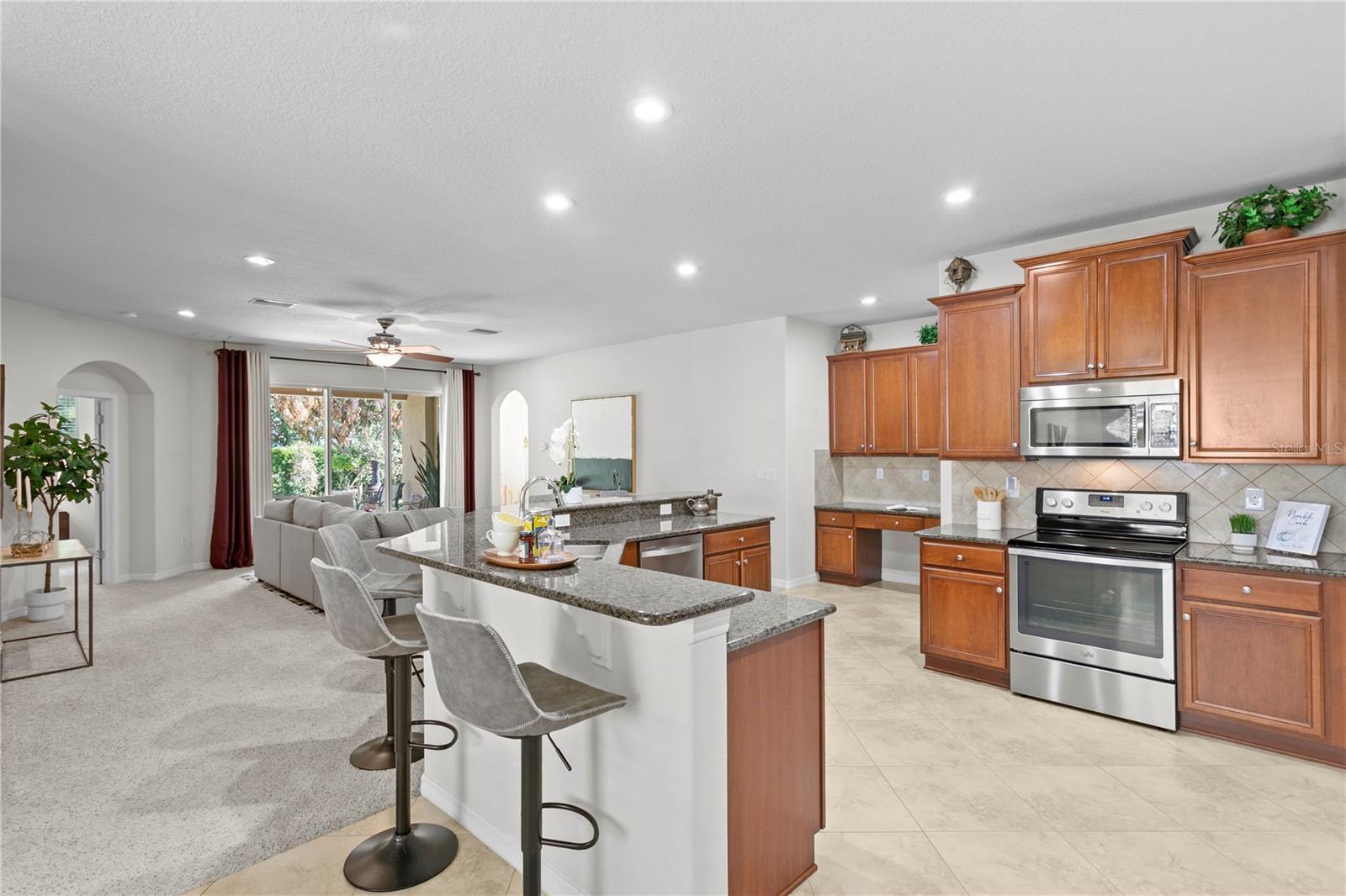 View from dinette area looking into kitchen/family room combo