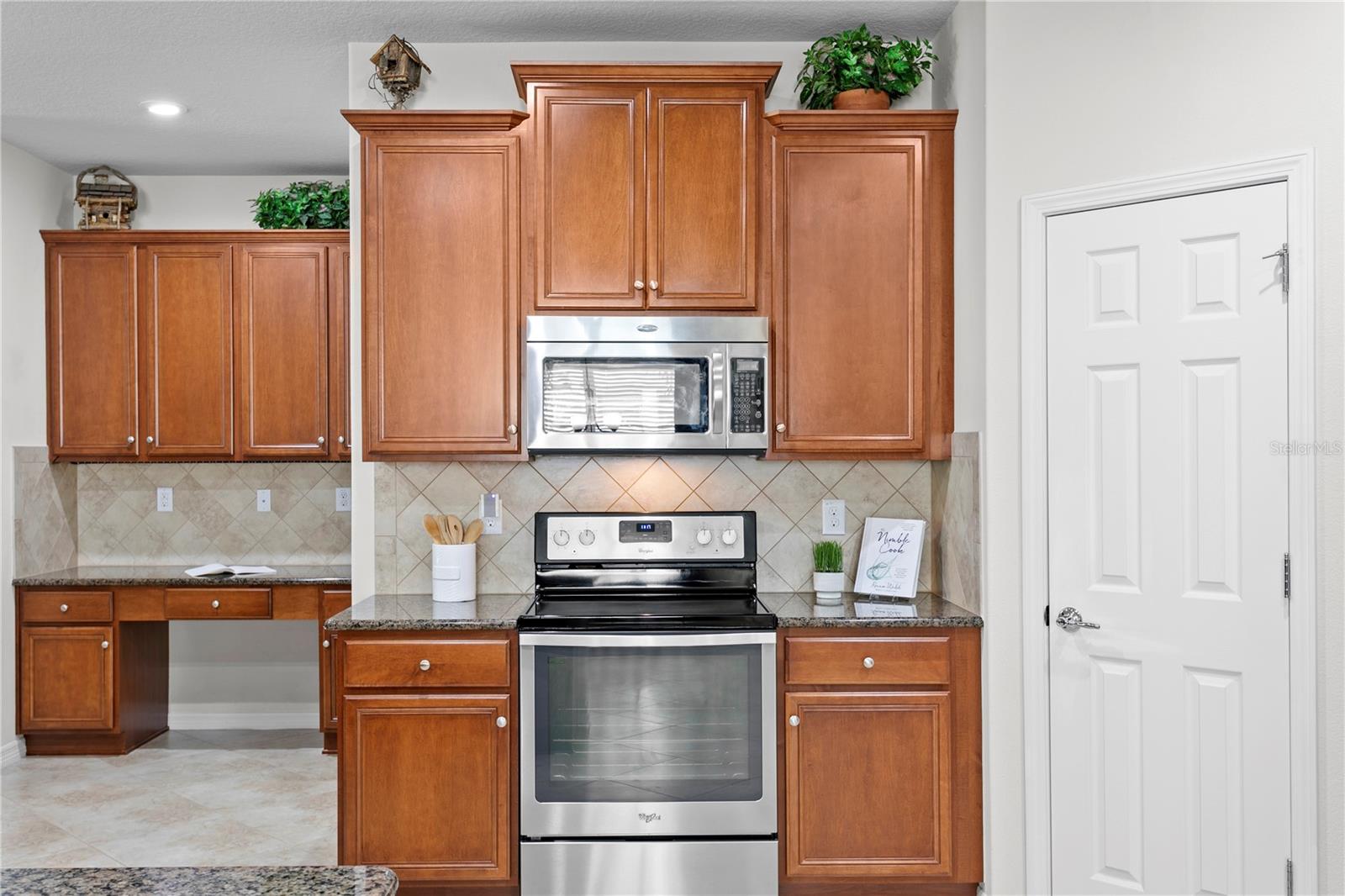 Kitchen features 42" cabinets and stainless steel appliances