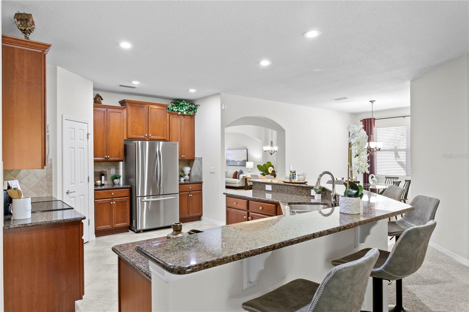 Kitchen features ample counter space and cabinets for convenience