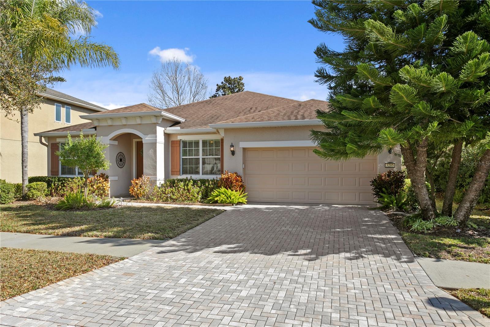 Oversided 3-car tandem garage and paver driveway