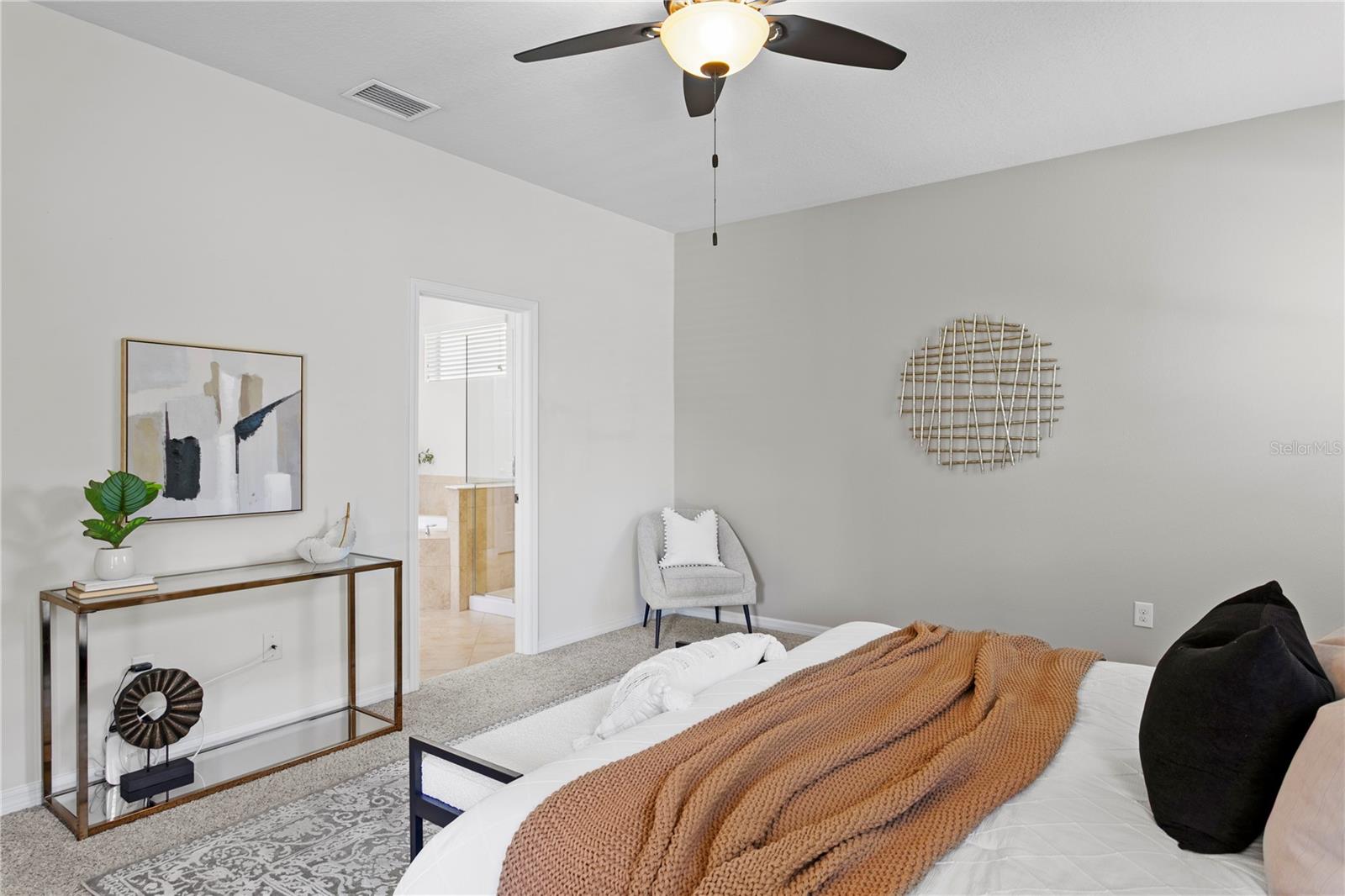 Primary bedroom features en-suite bath