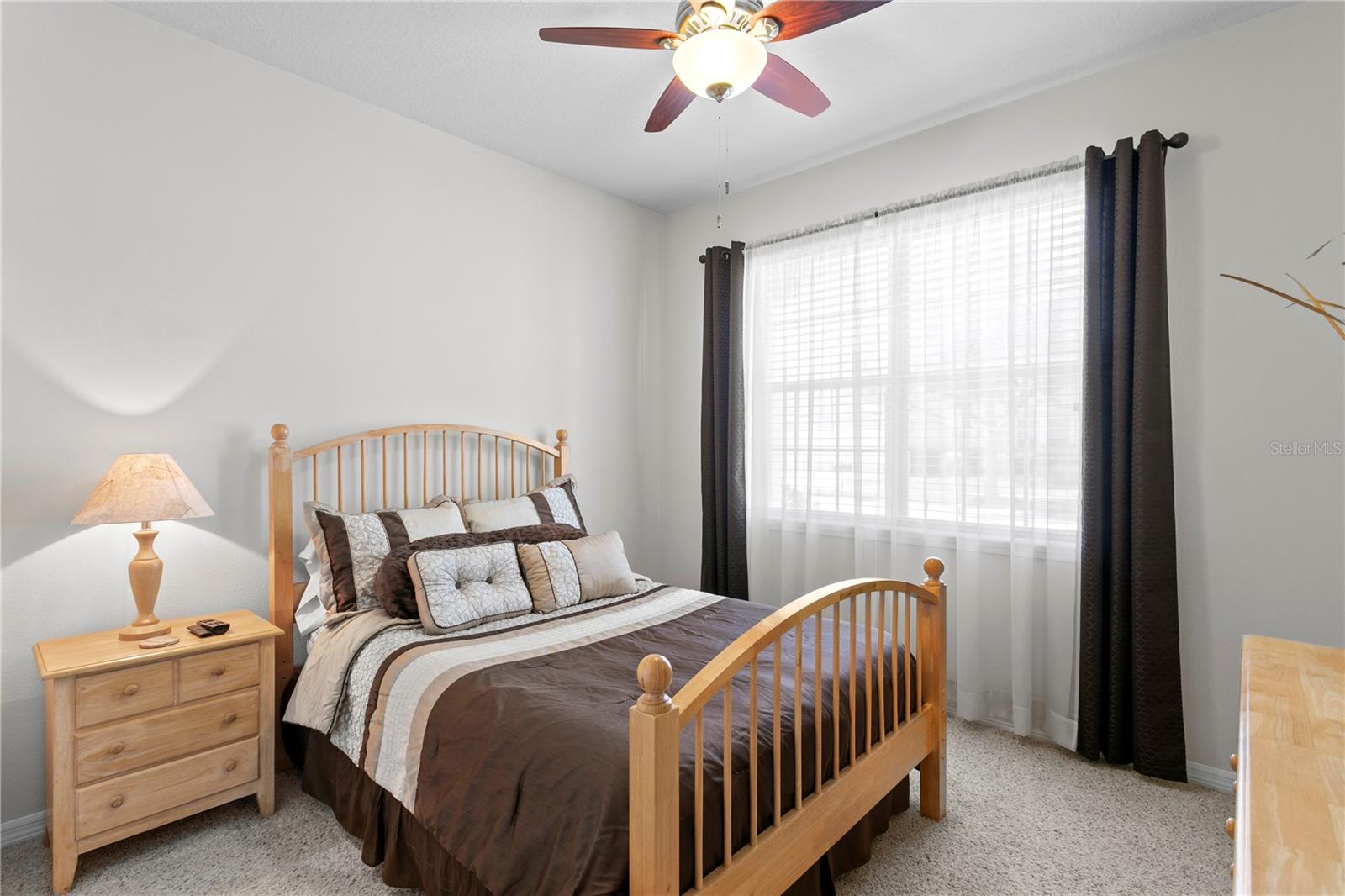 Bedroom 4 features ceiling fan and carpet flooring
