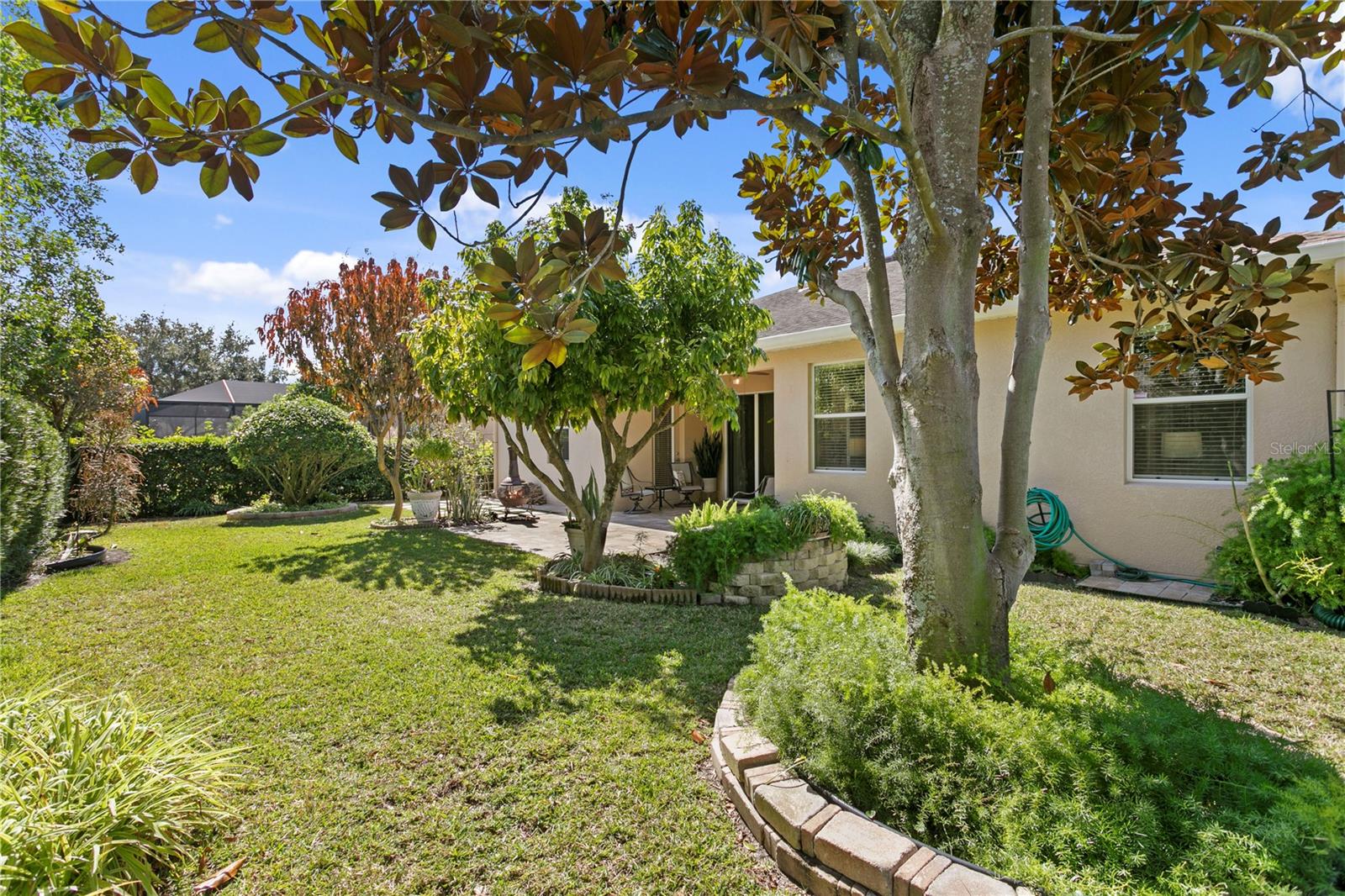 Manicured lawn with well maintained landscaping