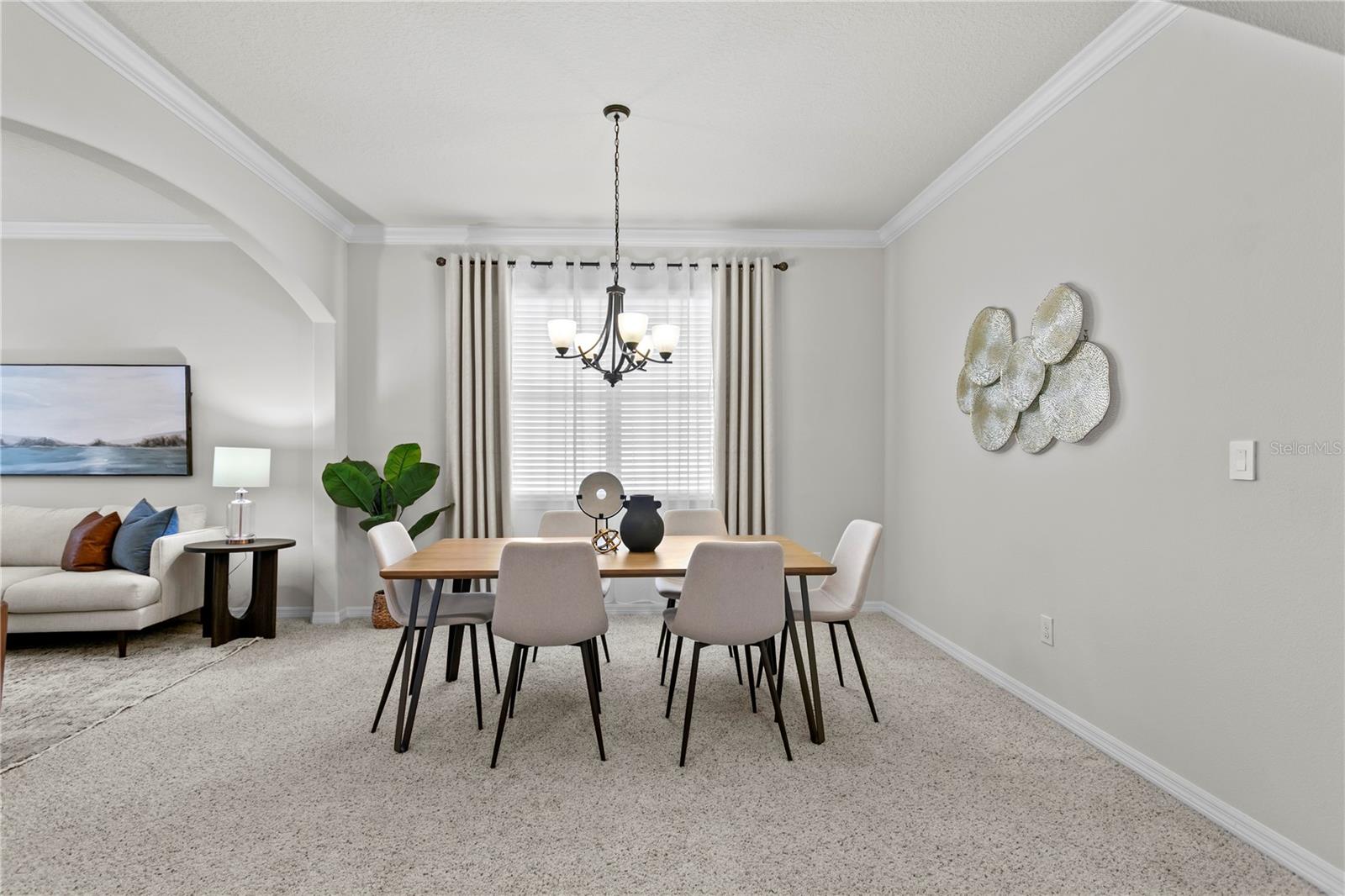 Dining room adjacent to front living room with large window