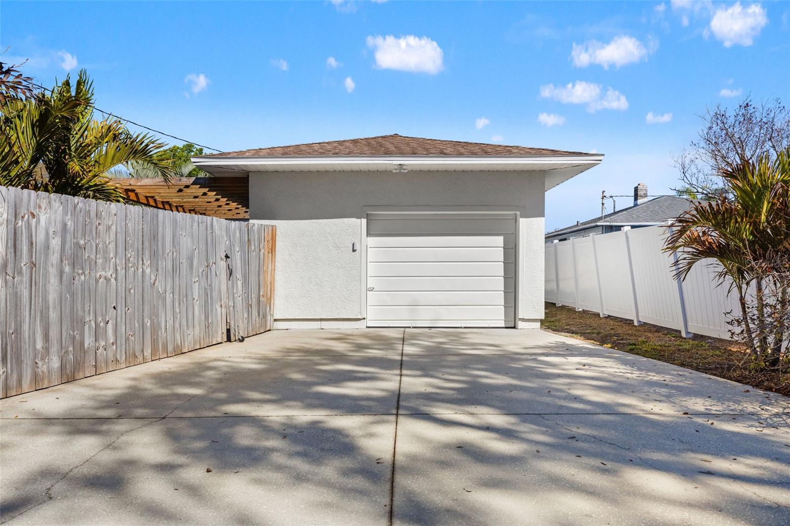 Attached 1-car garage with alley access.