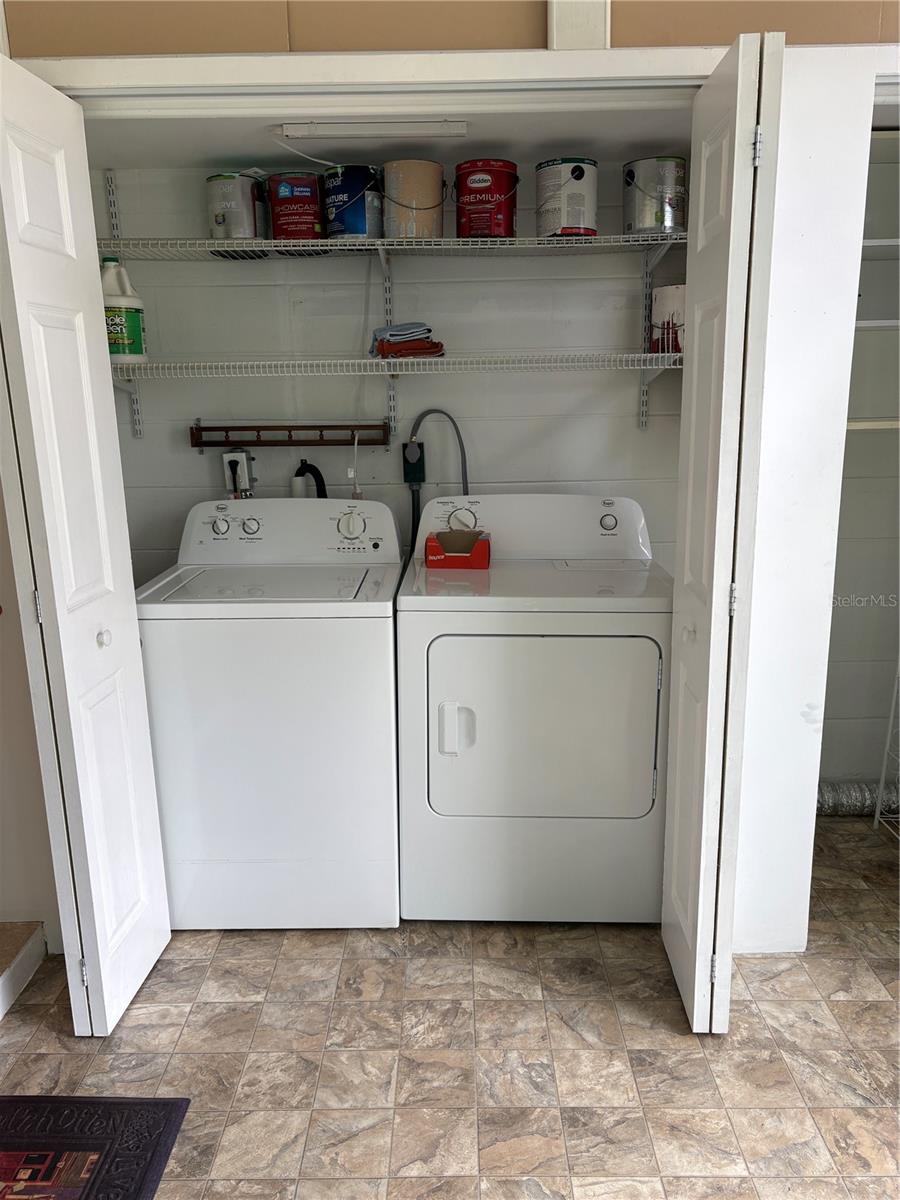 There is a full sized washer a dryer.