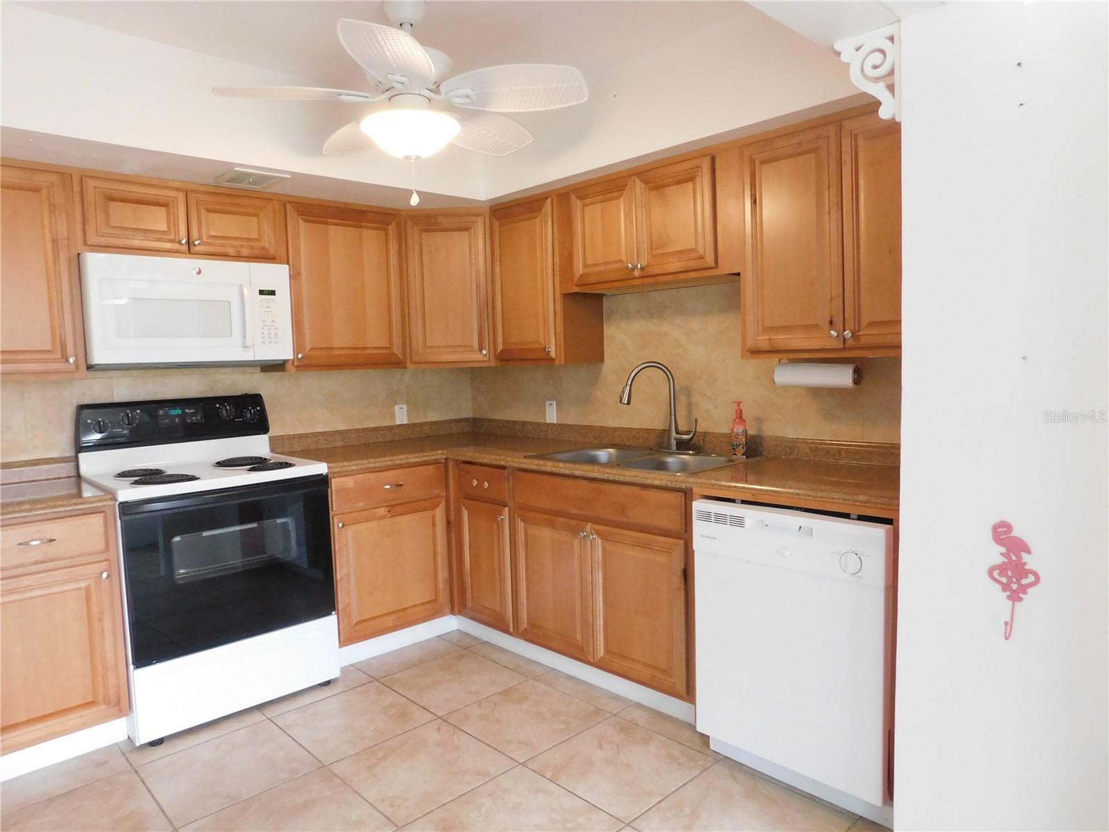 The updated kitchen includes a built-in microwave and dishwasher.