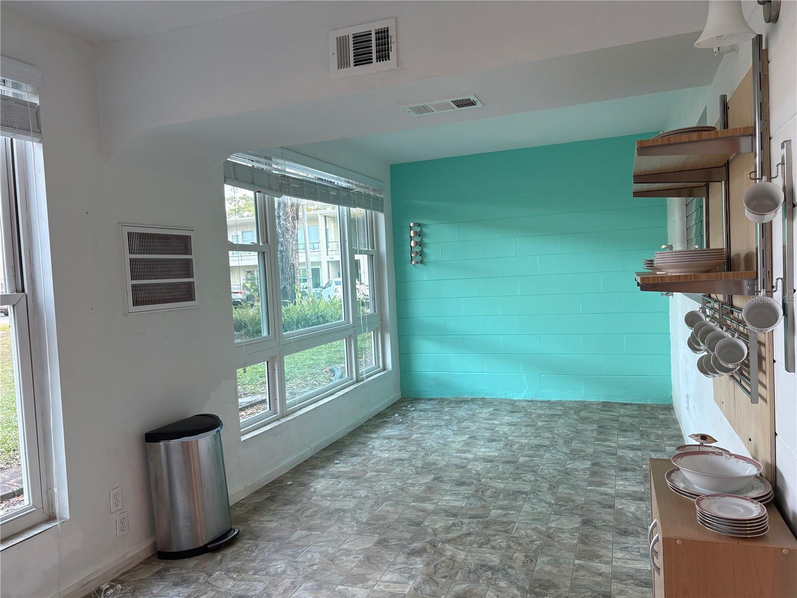 The inviting Florida Room can be used for a variety of purposes.