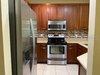 Kitchen offers SS Apliances and Wood Cabinets & Stone Cabinets