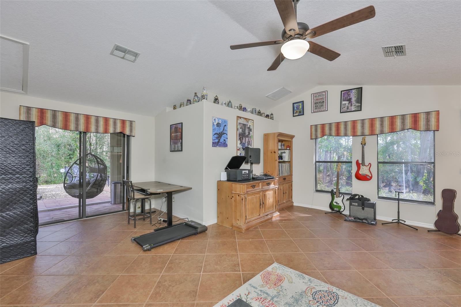 Access to back yard / paved patio deck and firepit