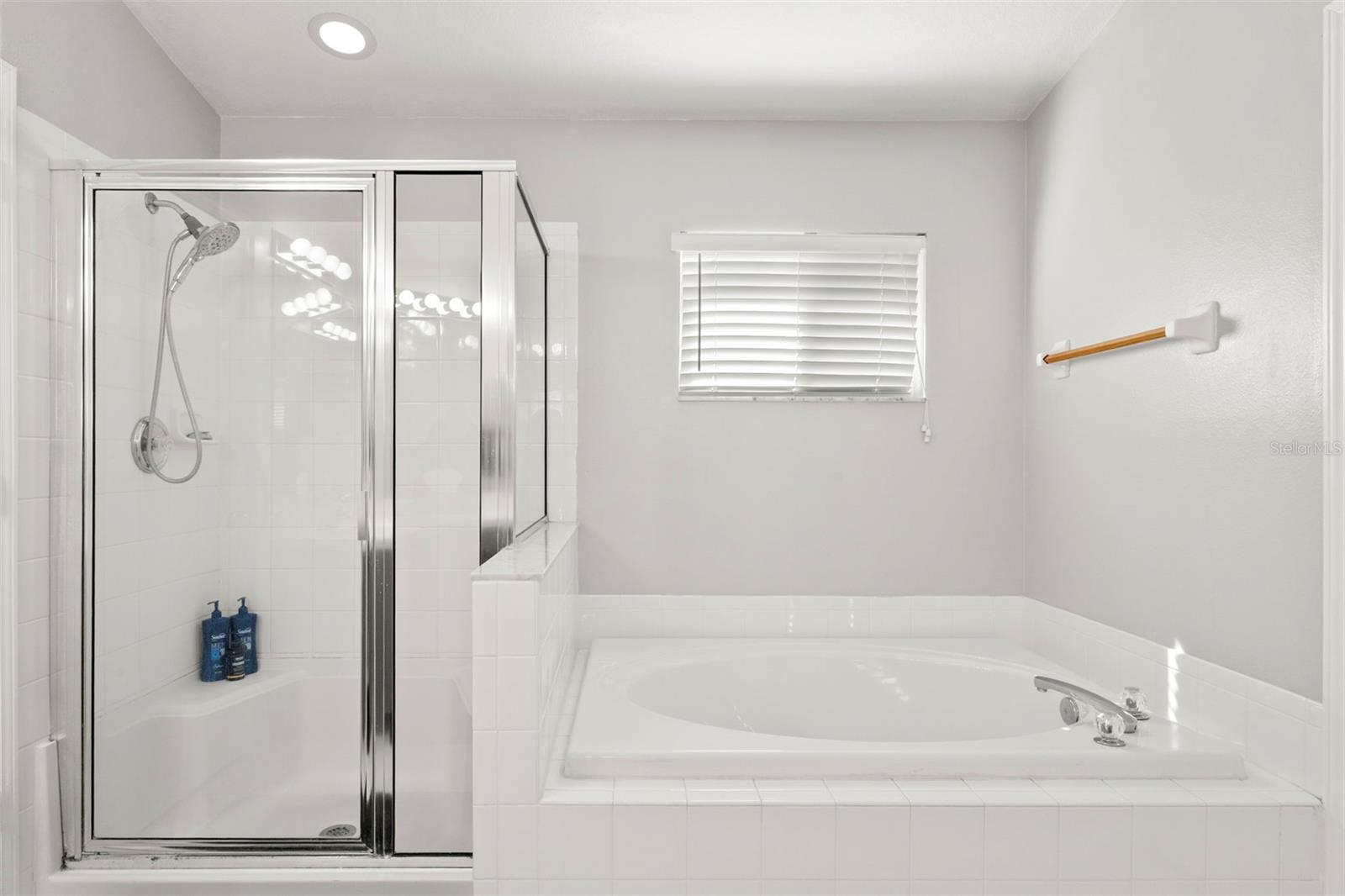 Large soaking tub with nice walk-in shower