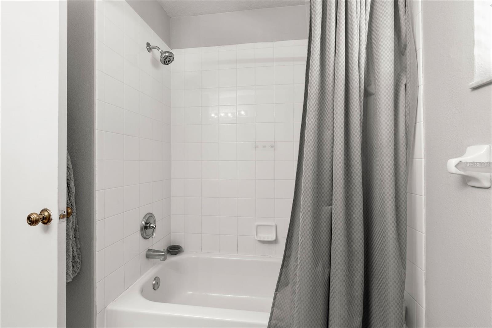 Second bath also has tub and shower combo