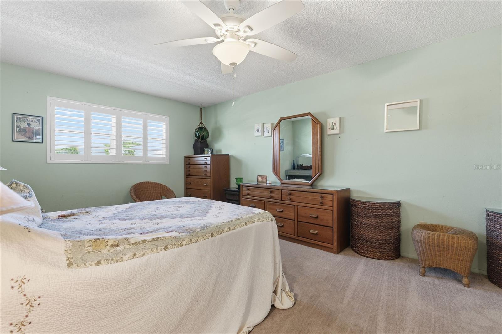 Spacious primary bedroom with natural light
