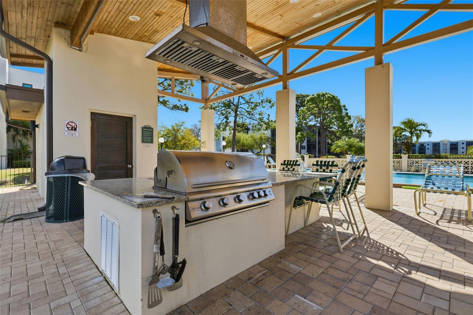 Outdoor grilling area by the pool