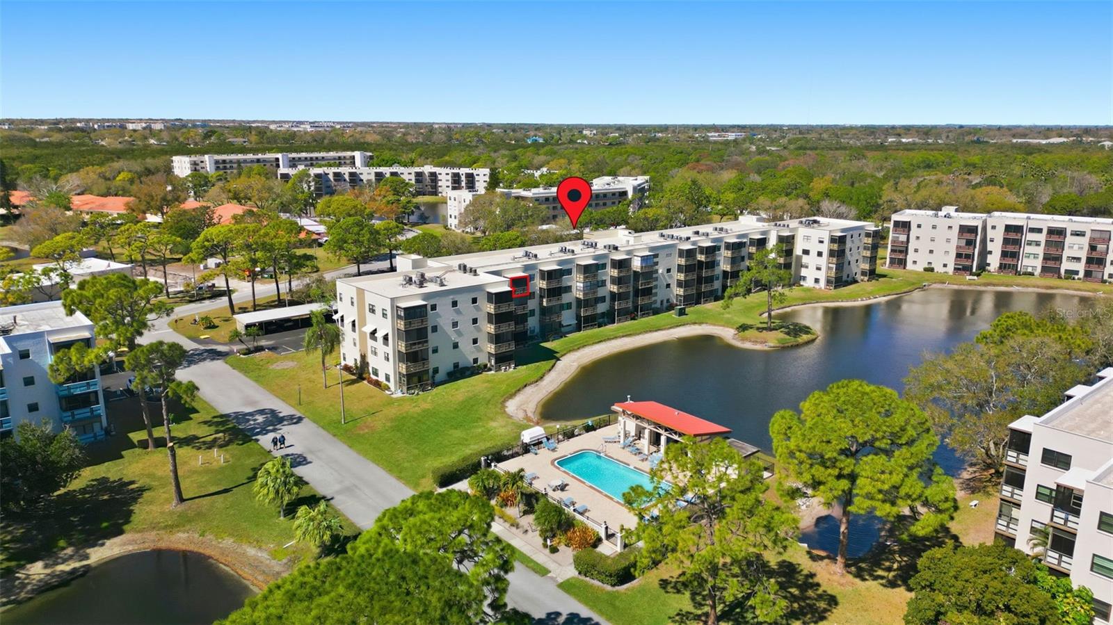 Drone view showing community pool and grounds