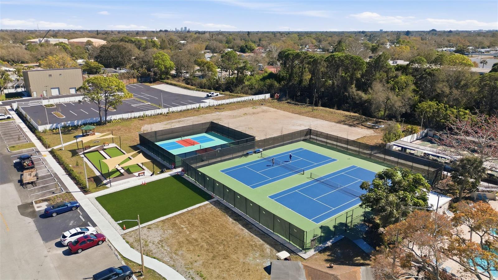 Drone view highlighting Five Towns resort-style amenities and community spaces