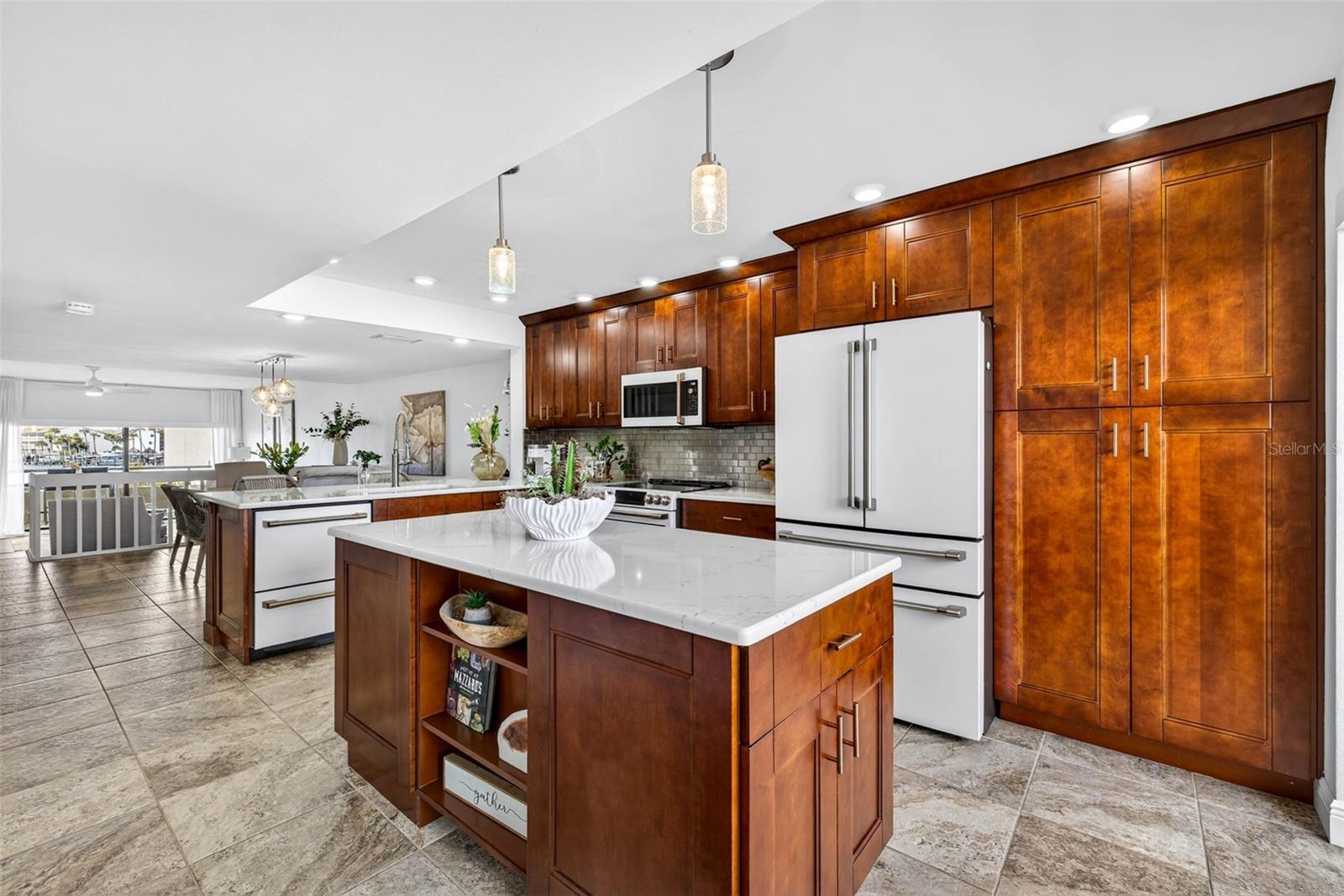 Beautiful cherry cabinets and sleek white appliances