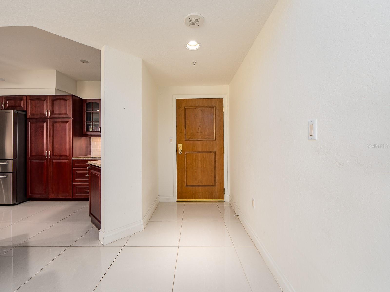 Welcomed by beautiful large tiles throughout the kitchen, dining, living, and hallways