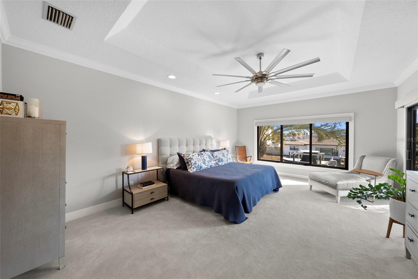 The primary features a tray ceiling and plenty of space