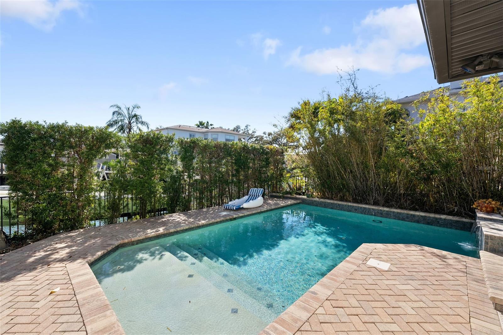 Outside, there is a pool