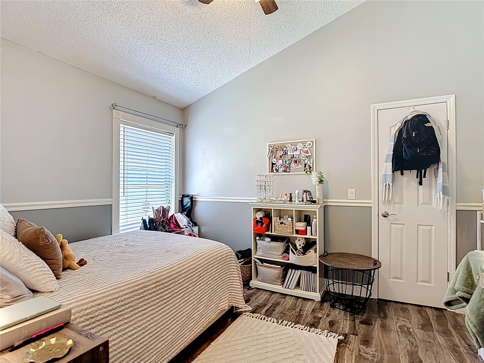 Generously sized Bedroom 3 feature vaulted ceilings, and a walk-in closet.